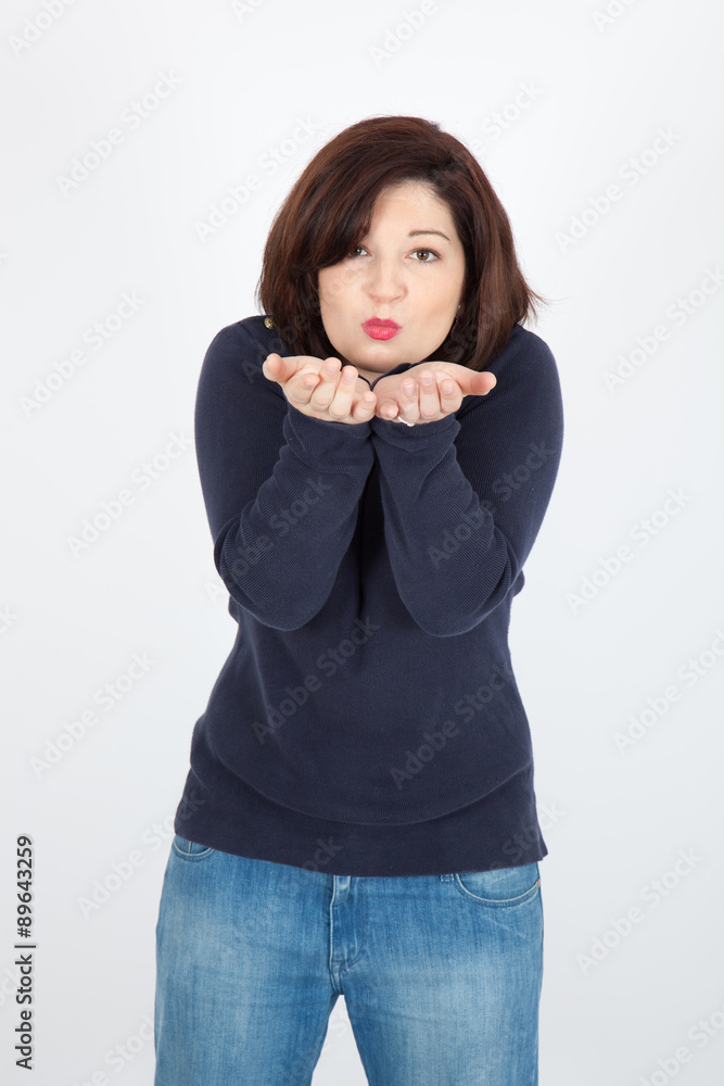 Beautiful woman doing different expressions in different sets of clothes: kiss Beautiful woman doing different expressions in different sets of clothes: kiss