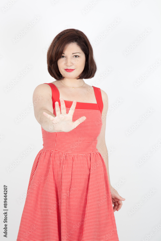 Beautiful woman doing different expressions in different sets of clothes: stop sign Beautiful woman doing different expressions in different sets of clothes: stop sign