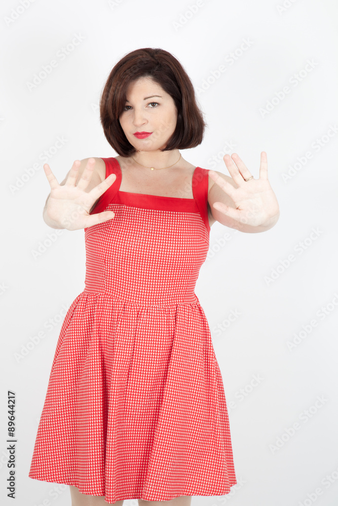 Beautiful woman doing different expressions in different sets of clothes: stop sign Beautiful woman doing different expressions in different sets of clothes: stop sign