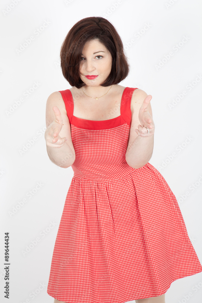 Beautiful woman doing different expressions in different sets of clothes: gun sign Beautiful woman doing different expressions in different sets of clothes: gun sign
