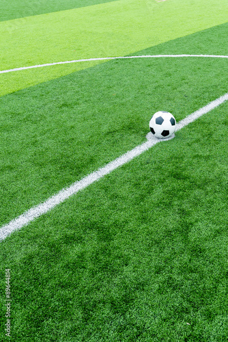 soccer field grass with ball at kick off point. © pongsakorn_jun26
