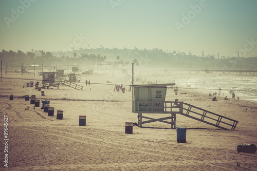 Vintage retro picture of wooden lifeguard tower, Beach in Califo