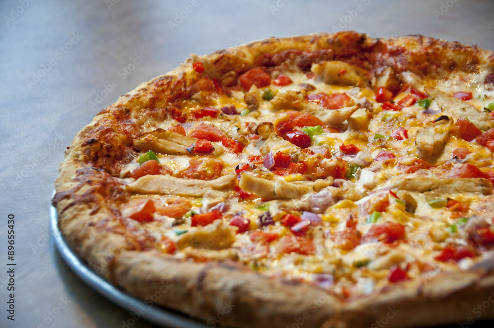 grilled chicken pizza with vegetables tomatoes and green peppers