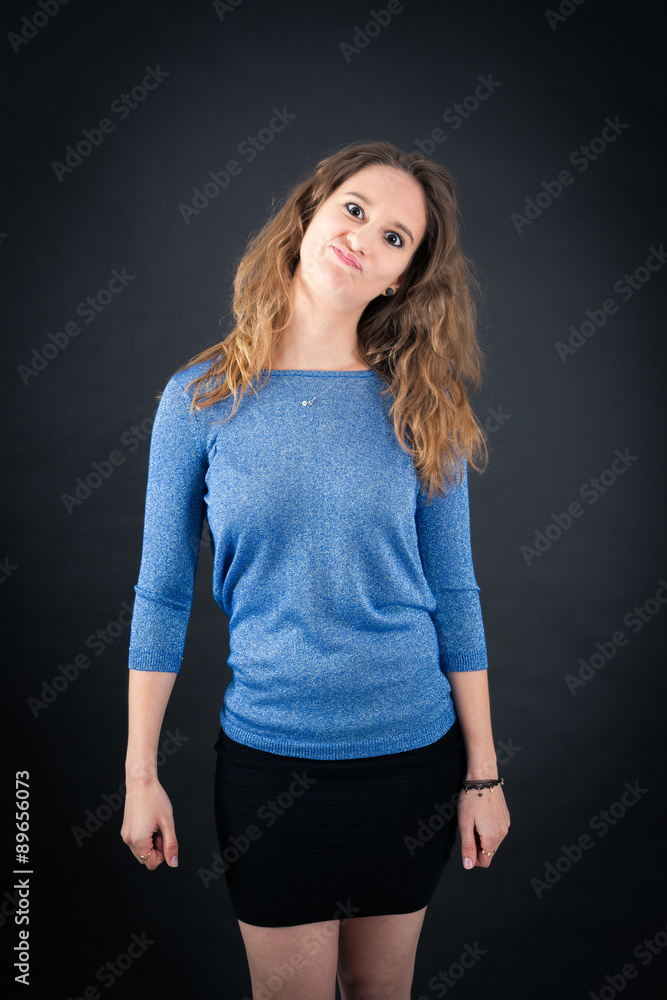 Beautiful woman doing different expressions in different sets of clothes: making a face Beautiful woman doing different expressions in different sets of clothes: making a face