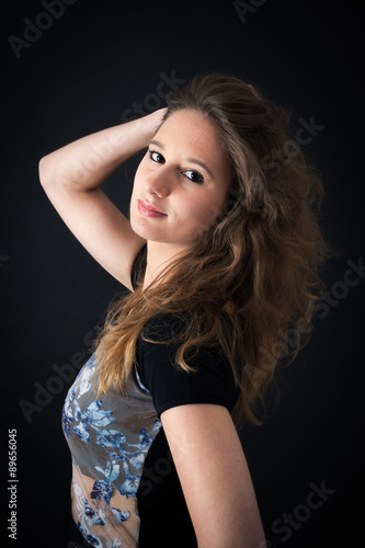 Beautiful woman doing different expressions in different sets of clothes: posing