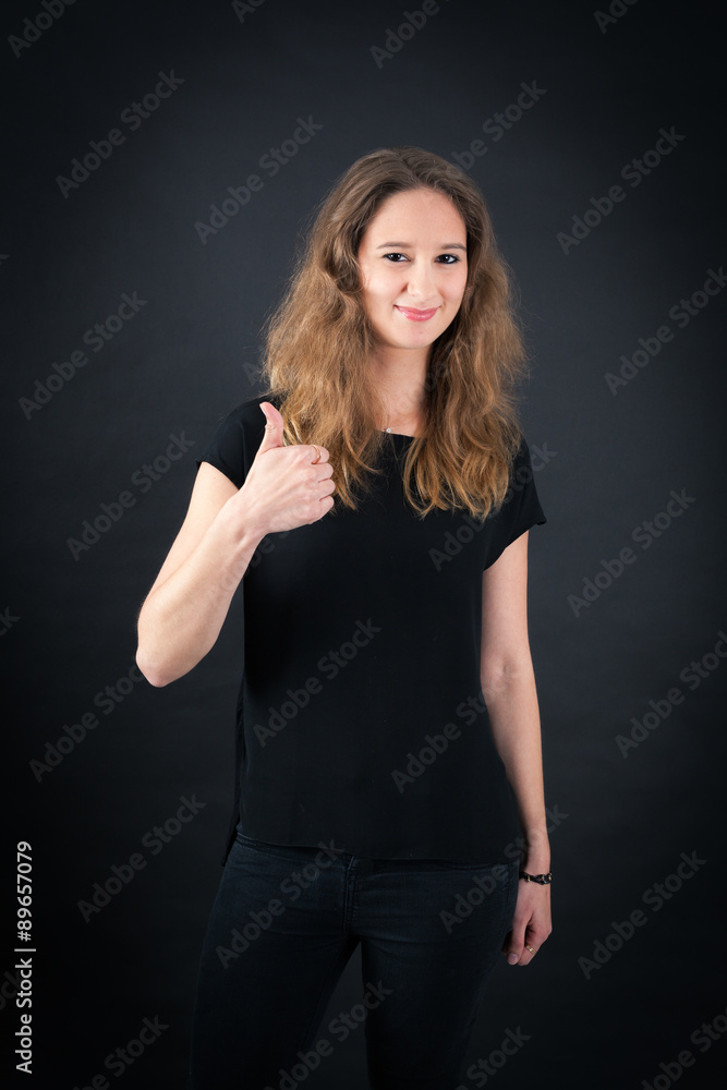 Beautiful woman doing different expressions in different sets of clothes: thumb sup Beautiful woman doing different expressions in different sets of clothes: thumb sup