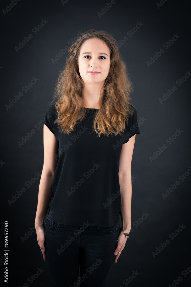 Beautiful woman doing different expressions in different sets of clothes: at attention Beautiful woman doing different expressions in different sets of clothes: at attention