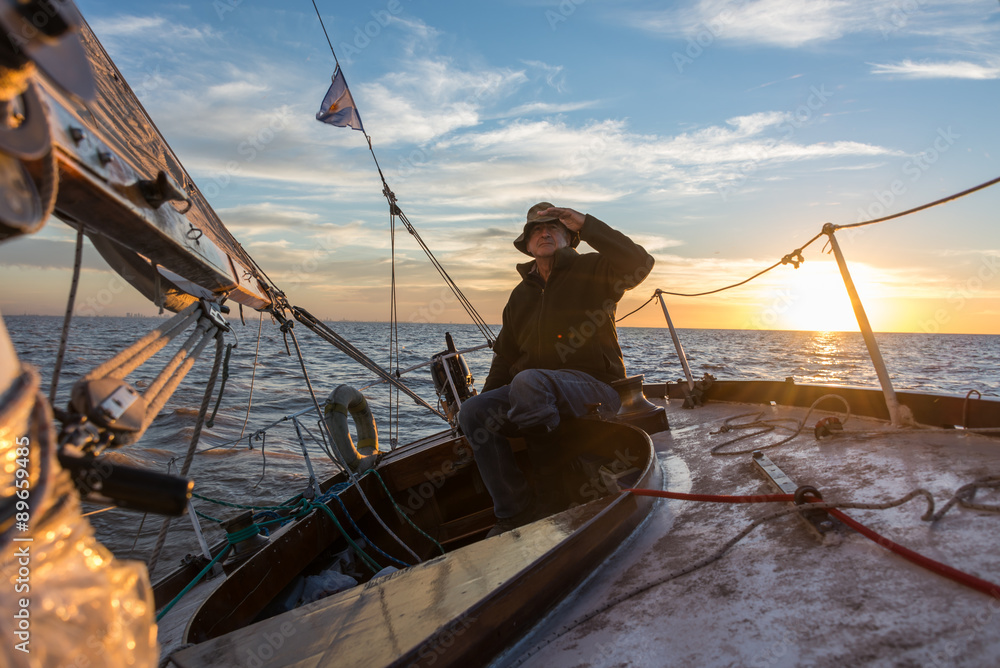 Naklejka premium Senior retired sailing Buenos Aires River to Uruguay. Sport free