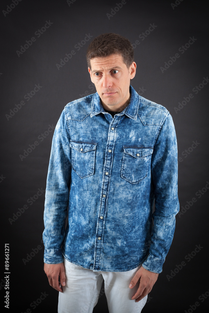 Handsome man doing different expressions in different sets of clothes: sad Handsome man doing different expressions in different sets of clothes: sad