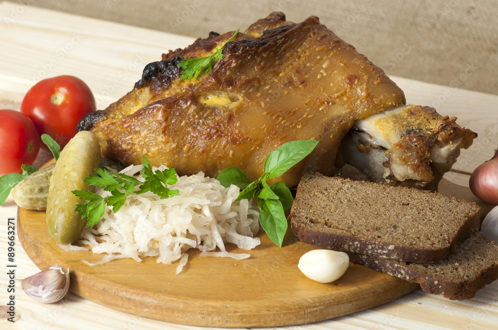Roasted pork leg served with sauerkraut Roasted pork leg served with sauerkraut