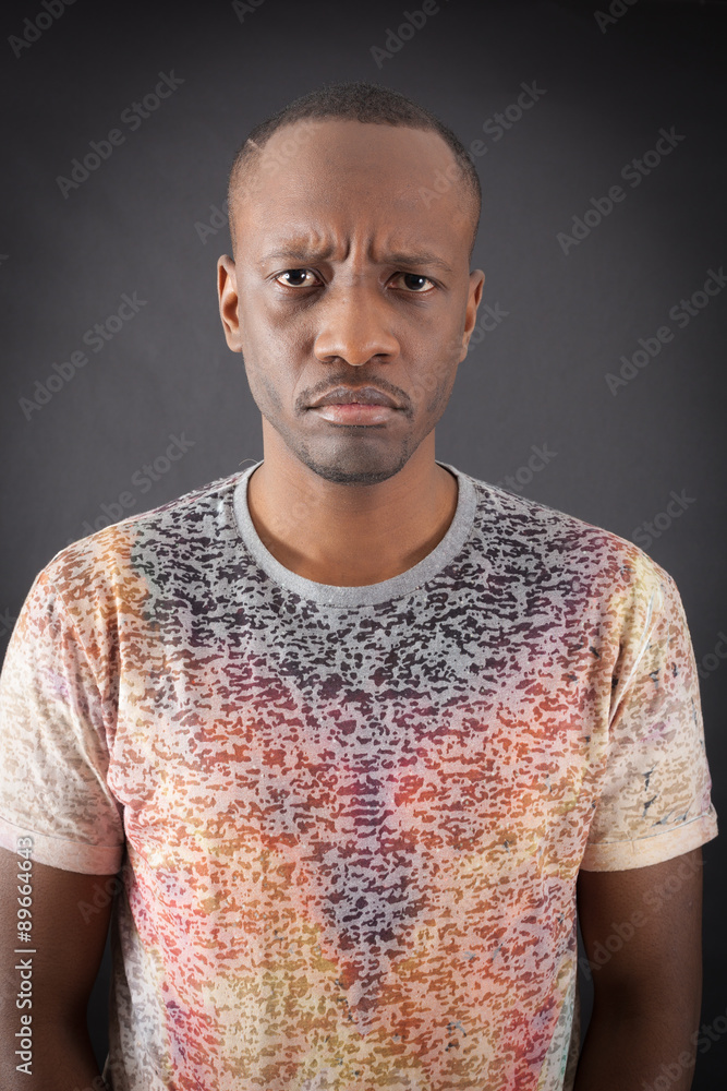 Fototapeta premium Handsome man doing different expressions in different sets of clothes: angry