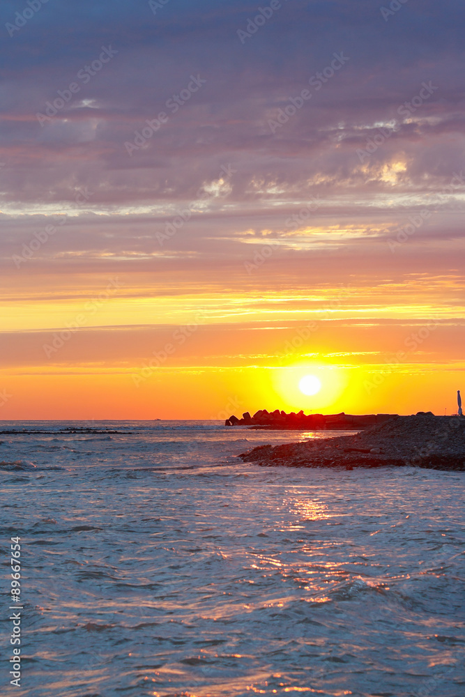 Fototapeta premium Tranquil sea sunset on a background the cloudy sky