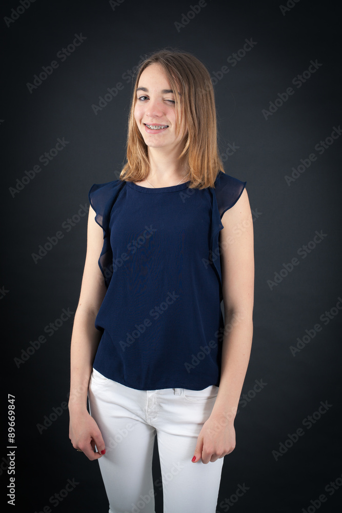 Beautiful woman doing different expressions in different sets of clothes: blinking Beautiful woman doing different expressions in different sets of clothes: blinking