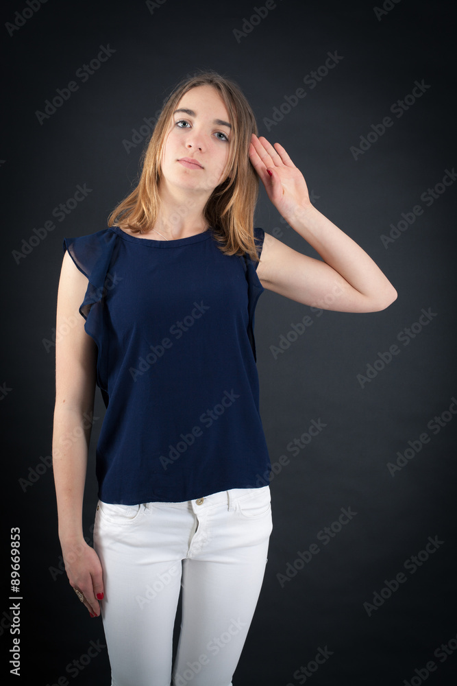 Beautiful woman doing different expressions in different sets of clothes: at attention Beautiful woman doing different expressions in different sets of clothes: at attention