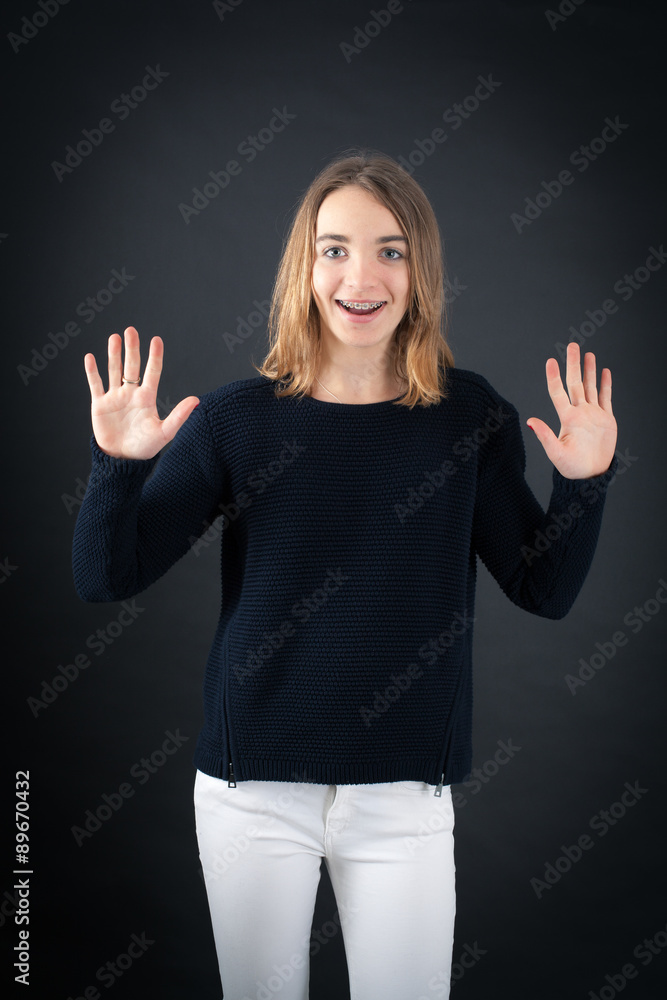 Beautiful woman doing different expressions in different sets of clothes: arrms raised Beautiful woman doing different expressions in different sets of clothes: arrms raised