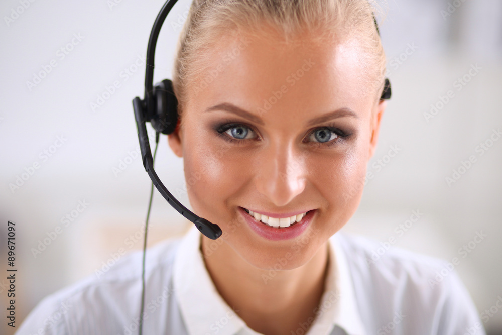 Close-up portrait of a customer service agent sitting at office Close-up portrait of a customer service agent sitting at office