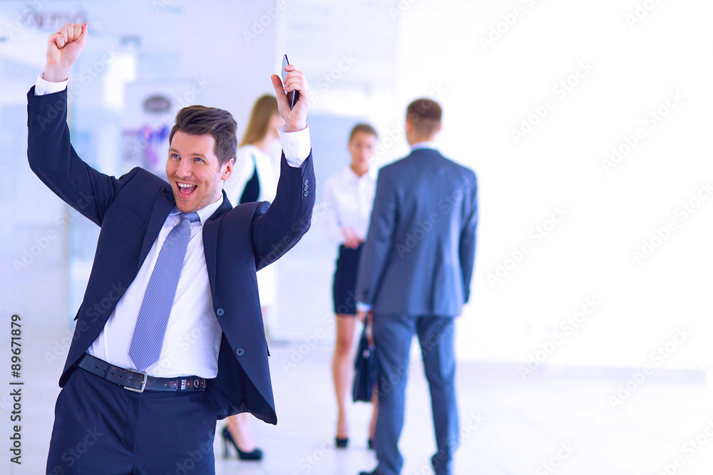 Business team celebrating a triumph with arms up Business team celebrating a triumph with arms up