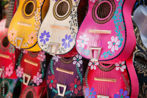 Background of colorful mexican guitars
