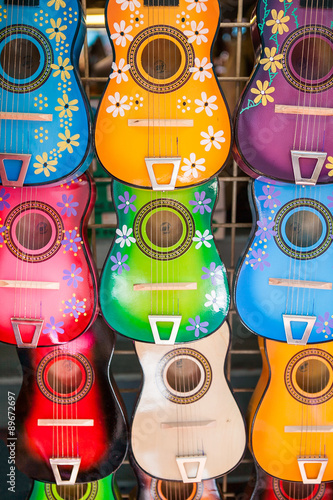 Background of colorful mexican guitars