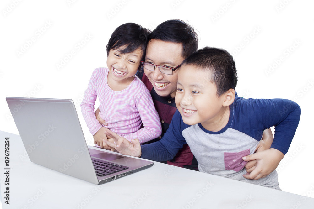Man and his children having fun with laptop Man and his children having fun with laptop