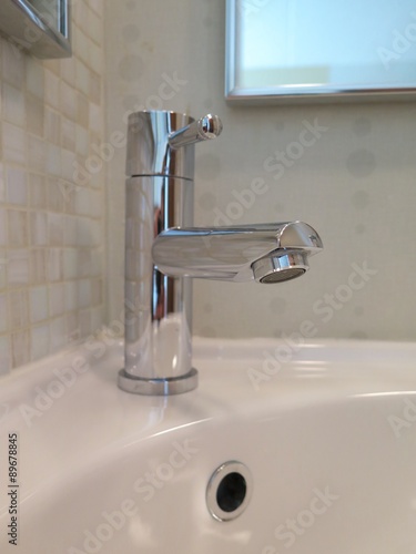 Restroom fixtures  sparking clean bathroom faucet and sink