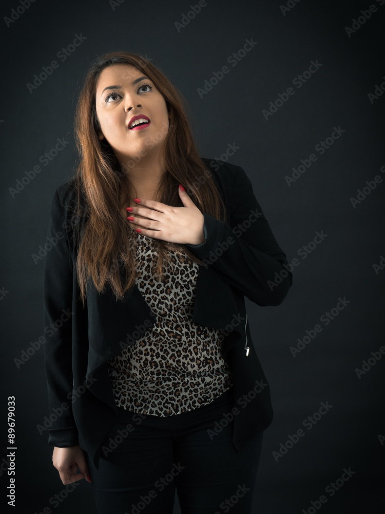 Beautiful woman doing different expressions in different sets of clothes: heart attack Beautiful woman doing different expressions in different sets of clothes: heart attack