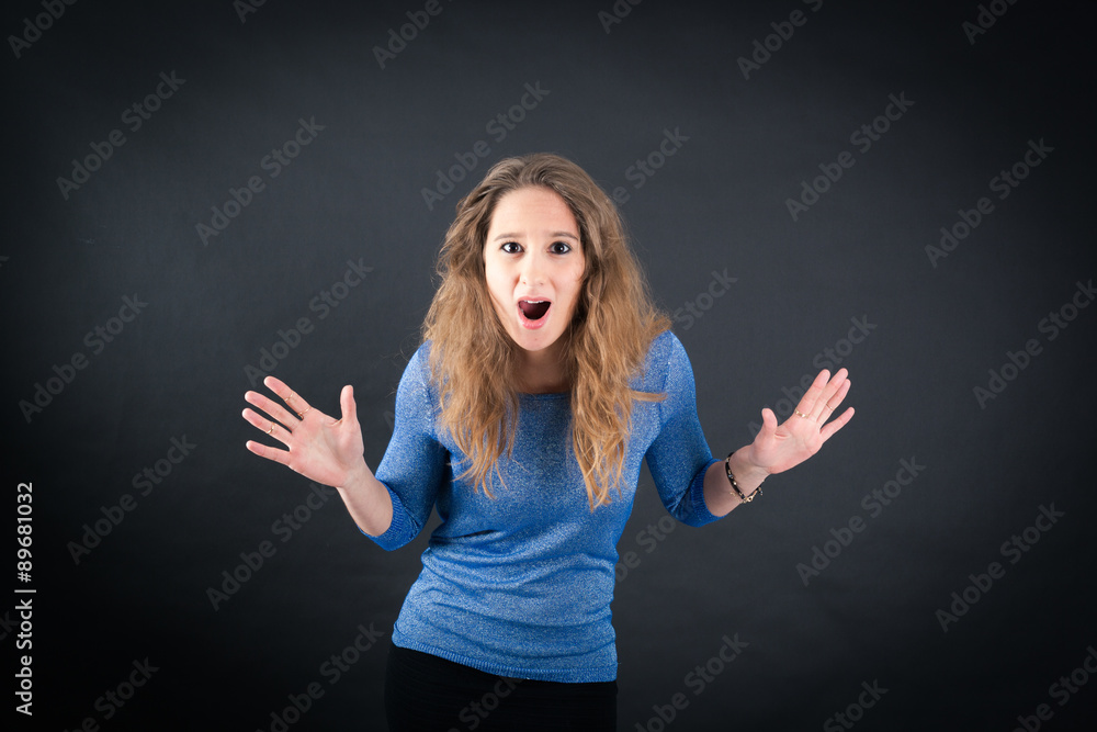 Beautiful woman doing different expressions in different sets of clothes: surprise Beautiful woman doing different expressions in different sets of clothes: surprise