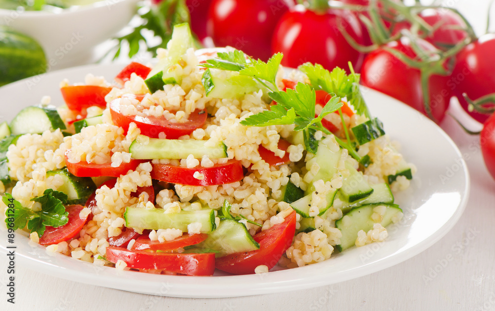 Healthy vegetable salad on a white plate. Healthy vegetable salad on a white plate.