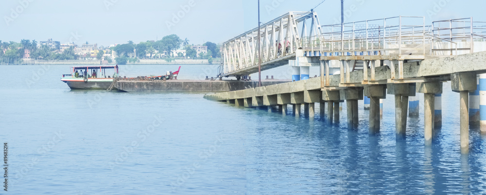 Fototapeta premium Jetty Ghat with a Boat carrying some person ..a panorama.
