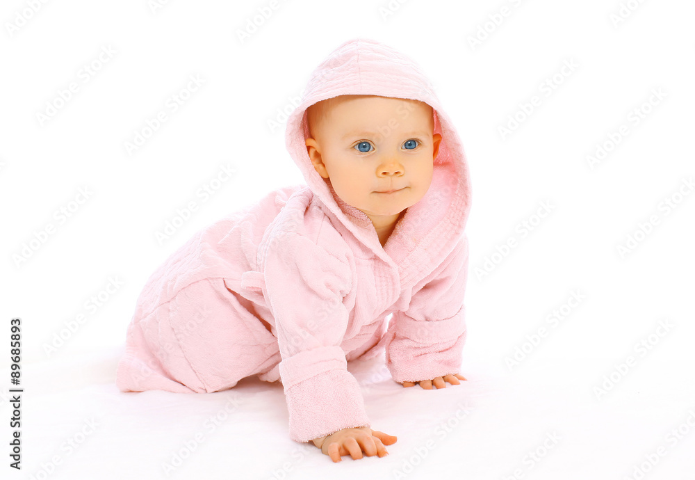Portrait of cute little baby crawls in the pink bathrobe Portrait of cute little baby crawls in the pink bathrobe