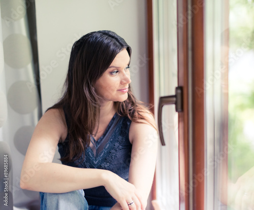 Free Download attractive young adult looking at the window - GFXLoad