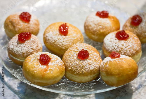 Fresh donuts with jam in a market bakery during the Jewish holiday of Hanukkah.
