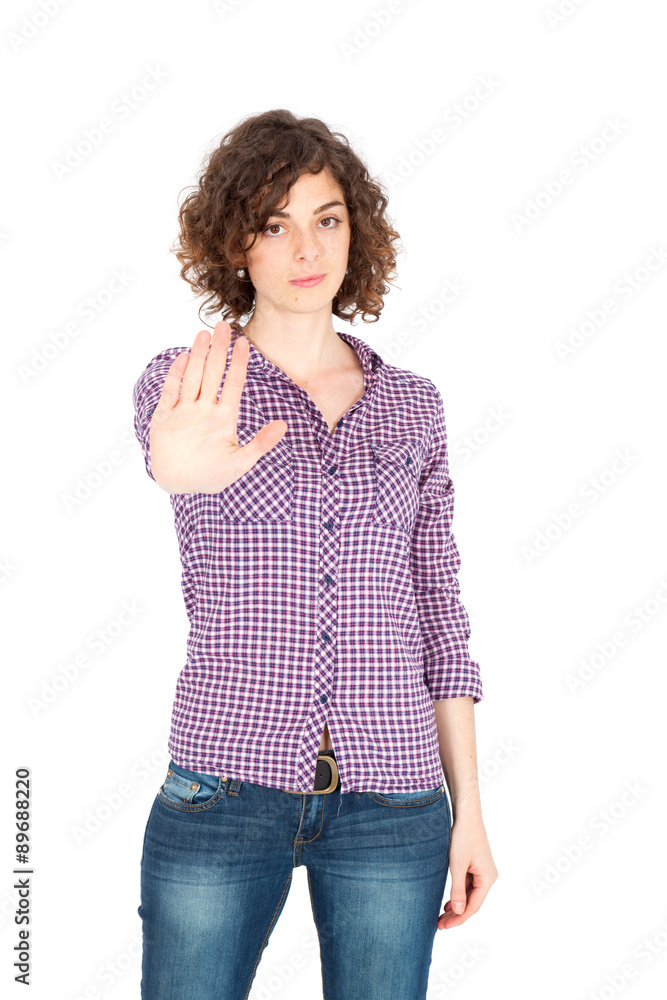 Beautiful Hispanic woman doing different expressions in different sets of clothes: stop sign Beautiful Hispanic woman doing different expressions in different sets of clothes: stop sign
