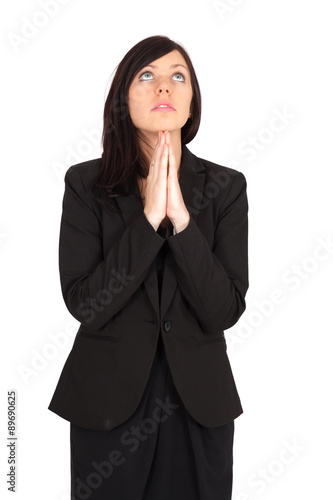 Beautiful woman doing different expressions in different sets of clothes: praying