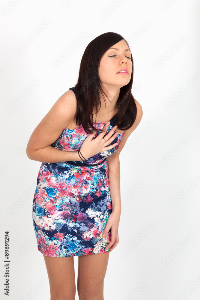Beautiful woman doing different expressions in different sets of clothes: heart attck Beautiful woman doing different expressions in different sets of clothes: heart attck