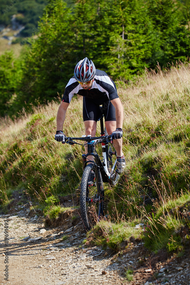 Fototapeta premium Mountain biker on trails