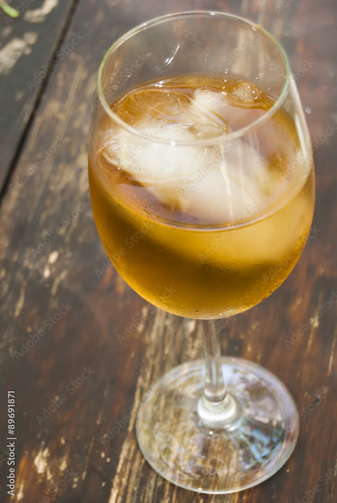 Glass of wine on a wooden table Glass of wine on a wooden table
