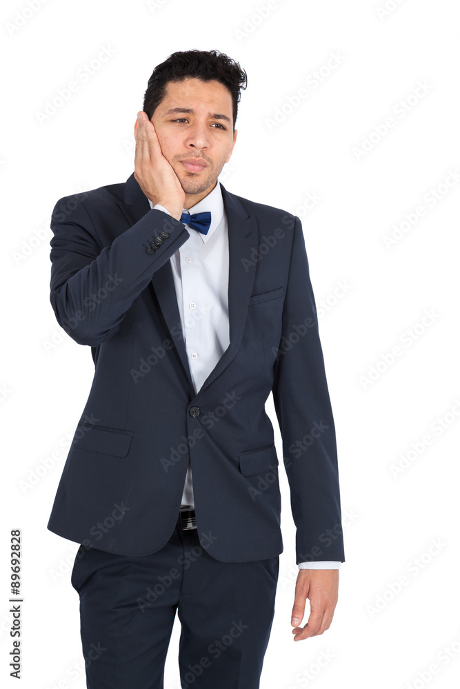Handsome man doing different expressions in different sets of clothes: toothache Handsome man doing different expressions in different sets of clothes: toothache