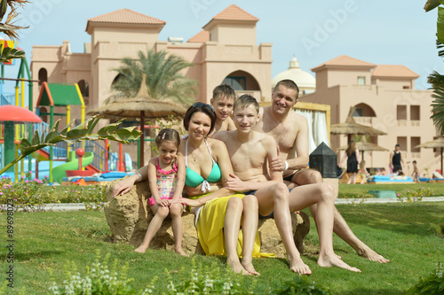 Family relaxing at vacation resort