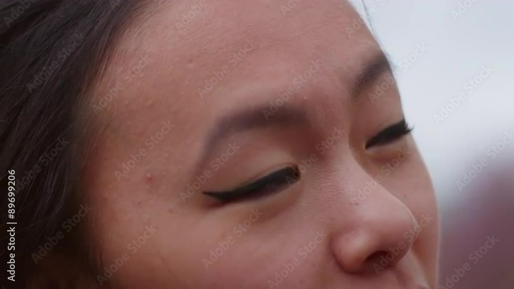 close-up and slow motion of a young woman talking with someone close-up and slow motion of a young woman talking with someone
