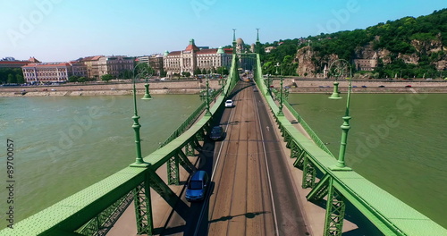 Hungary. Budapest. Flying over Liberty Bridge Freedom Buda aerial view moving right side camera. Travel tourism Landmark of Buda over Danube river.
