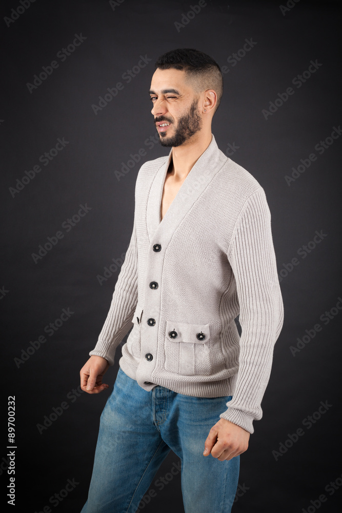 Fototapeta premium Handsome man doing different expressions in different sets of clothes: blinking