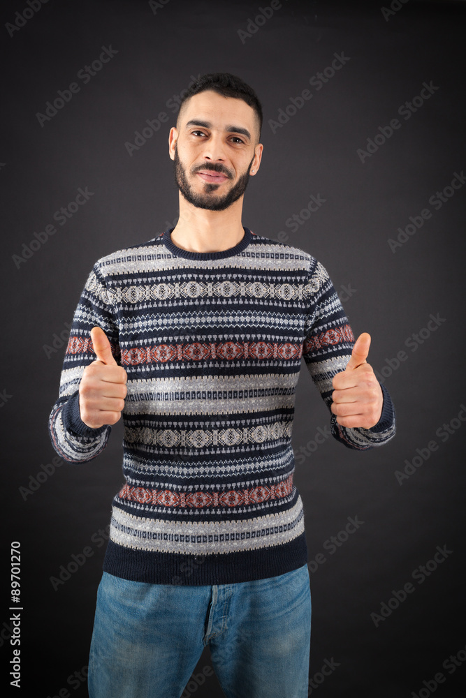 Handsome man doing different expressions in different sets of clothes: thumbs up Handsome man doing different expressions in different sets of clothes: thumbs up