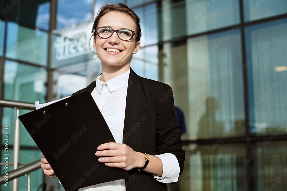 Fototapeta premium Happy Business woman, successful business lady portrait, manager holding documents.