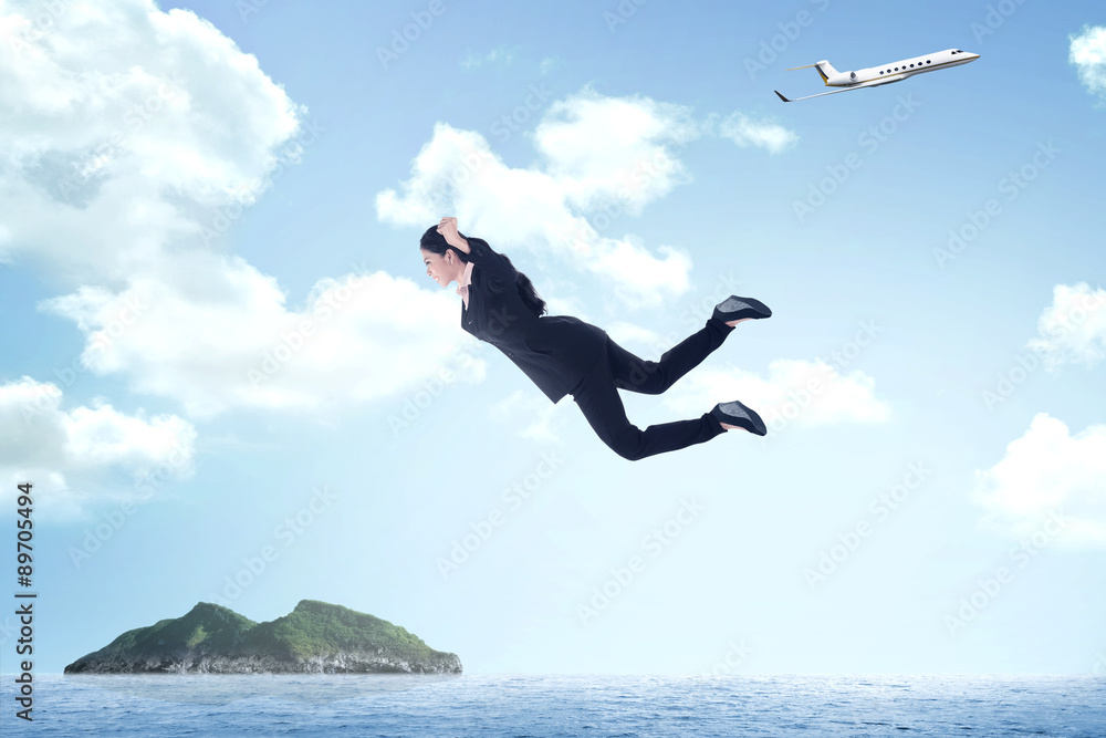 Business woman jumping from airplane Business woman jumping from airplane