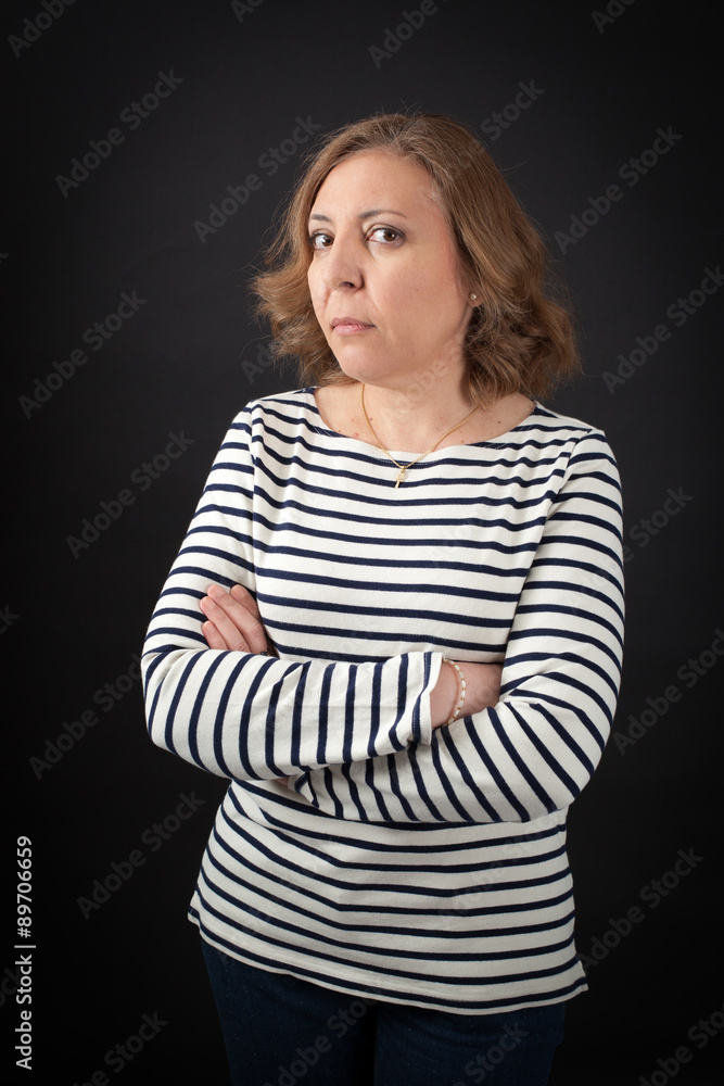 Beautiful woman doing different expressions in different sets of clothes: arms crossed Beautiful woman doing different expressions in different sets of clothes: arms crossed