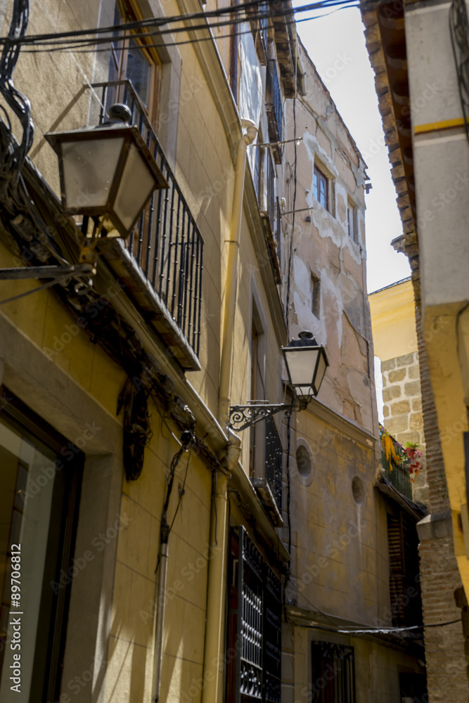 Ancient, streets of the city Toledo, medieval architecture and C