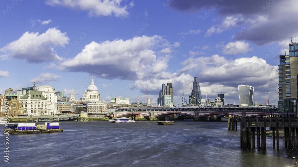 Timelapse view of St Paul cathedral and Blackfriars bridge with boats cruising on the river Thames and the skyline of the City of London in the background Timelapse view of St Paul cathedral and Blackfriars bridge with boats cruising on the river Thames and the skyline of the City of London in the background