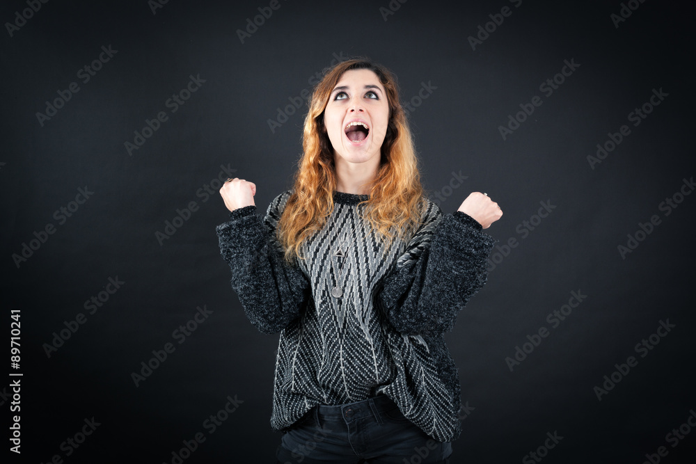 Beautiful woman doing different expressions in different sets of clothes: arms raised Beautiful woman doing different expressions in different sets of clothes: arms raised
