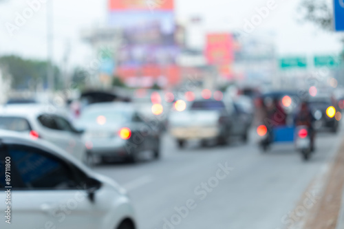 car driving on road with traffic jam in the city, abstract blurred